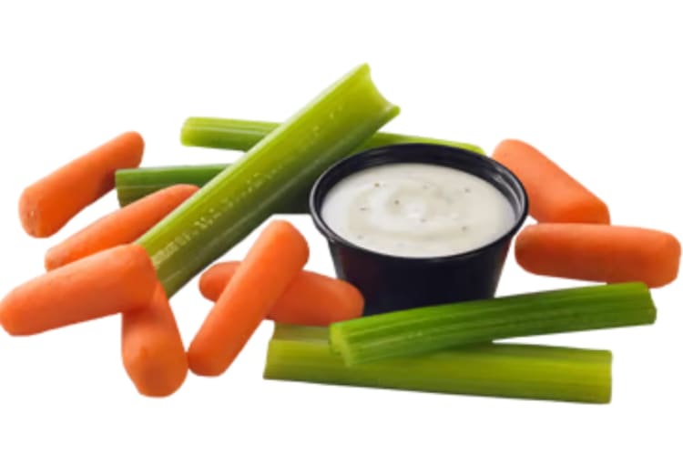 Carrots and celery with ranch dressing.