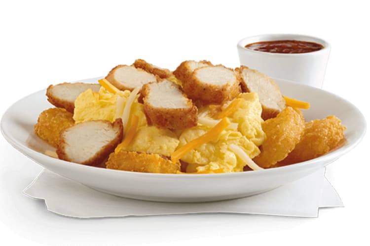 A hearty morning meal of sliced Chick-fil-A Nuggets, crispy Hash Browns, scrambled eggs and a blend of cheeses.