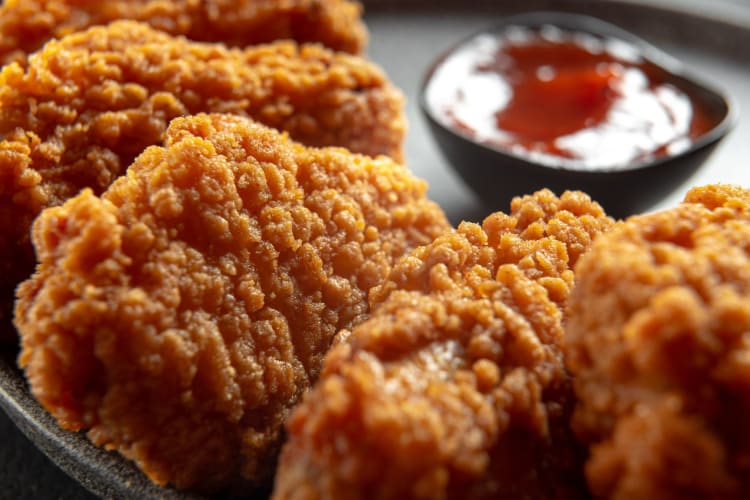 Fried chicken wings close-up.