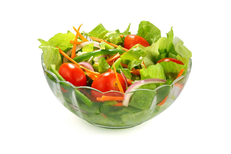 A bowl of side salad.