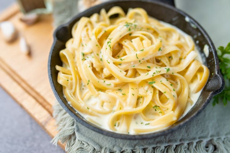 A bowl of creamy pasta Alfredo.