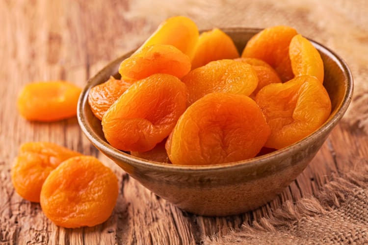 Dried apricots in a bowl.