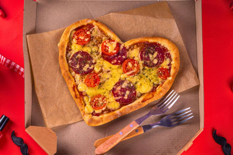 A delivery box of pizza.