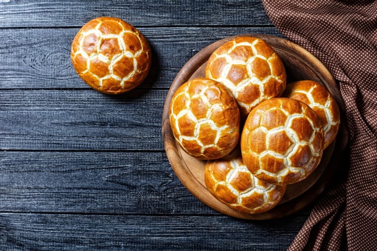 Aerial view of pineapple buns — a popular Hong Kong food — on a wooden serving plate