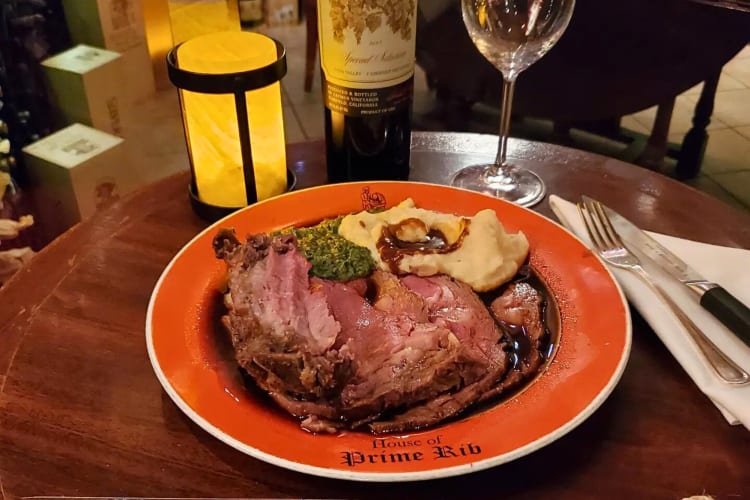 A House of Prime Rib meal with meat, creamed spinach and mashed potatoes