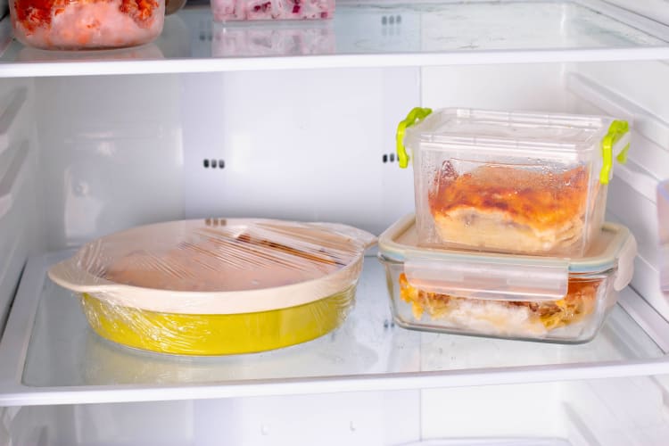 Glass containers of food in the fridge.