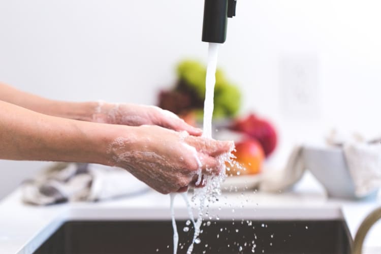 Woman washing her hands