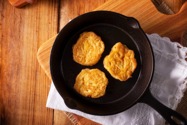 A cast iron skillet is essential for anyone learning how to get better at home cooking