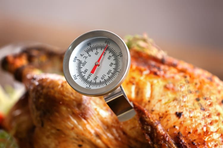 Identify the internal temp of the chicken breast with a meat thermometer