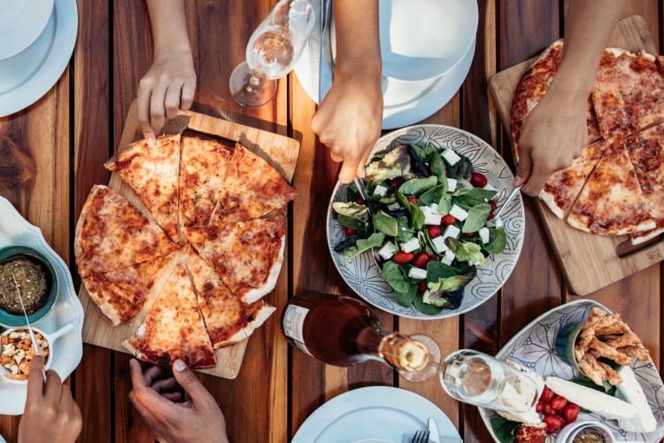 Is pizza bad for you? Improve the nutritional value by filling up on salad.