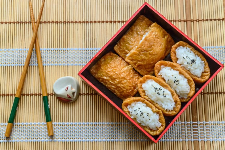 A box of inari sushi.