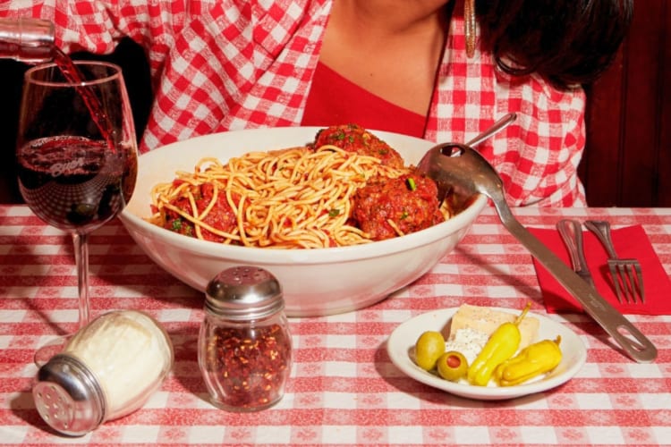 Spaghetti with meatballs and a glass of wine