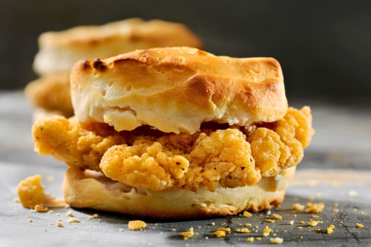 First, you can order a spicy chicken sandwich and ask to swap out the bun for a biscuit. Secondly, you can order a breakfast sandwich and ask for a chicken patty instead of the original protein.