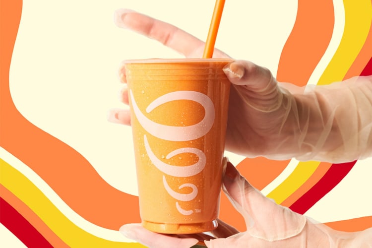 Orange Jamba Juice smoothie with a funky background