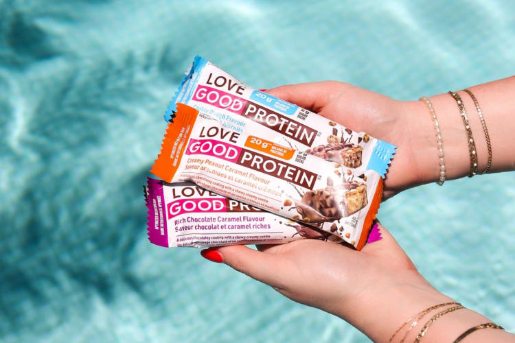 A hand holding keto protein bars.
