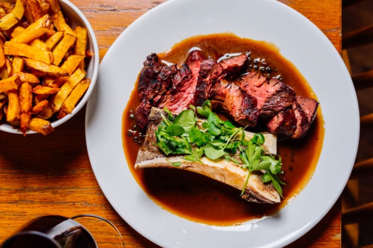 A hearty meat dish and chips served at a restaurant in Leeds