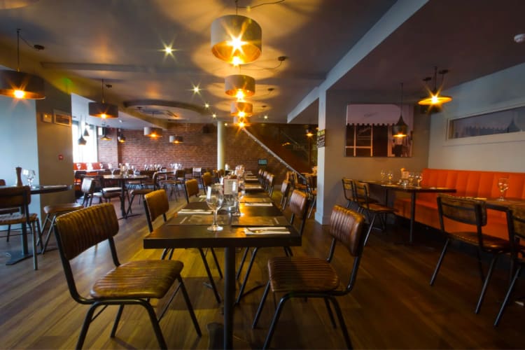 warm and inviting interior of an Italian restaurant in Leeds