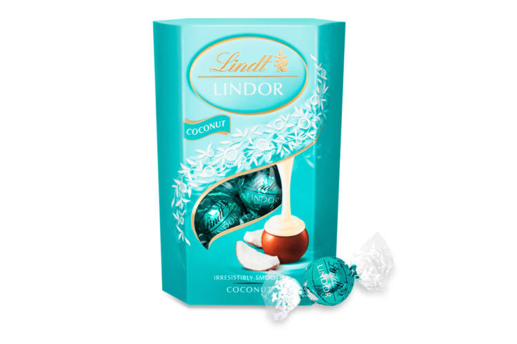A box of Coconut Lindor chocolate flavor truffles next to a single truffle