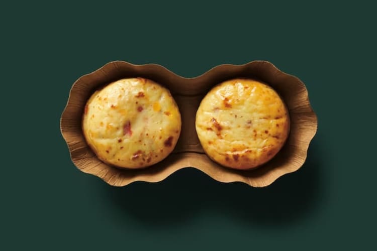 Two ham, cheddar and pepper Starbucks Sous Vide Egg Bites, one of the best low-carb fast foods