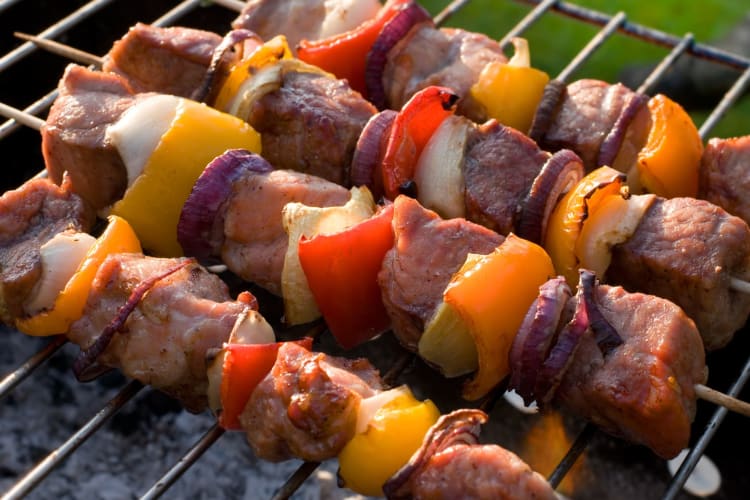 Pork kebabs on a barbecue.