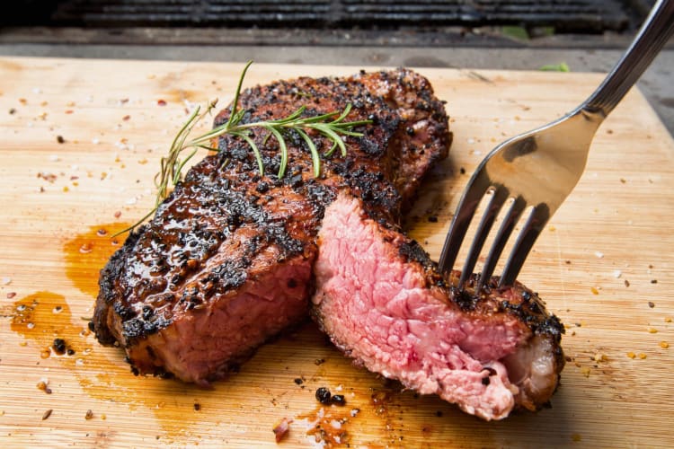 A New York steak on a chopping board.