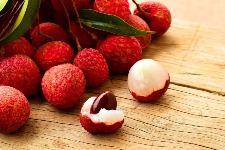 Fresh lychees with and without the rind