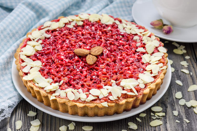 Tarte aux pralines, a delicious Lyon food, on a white plate