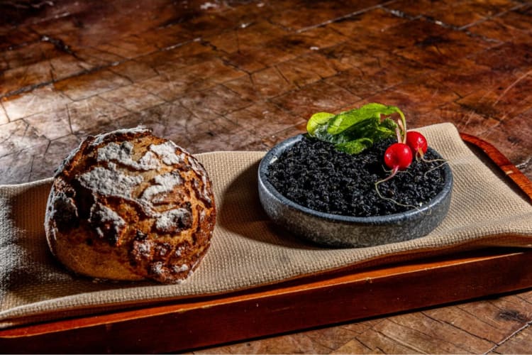 Tiger bread served with herb butter sesame raddish