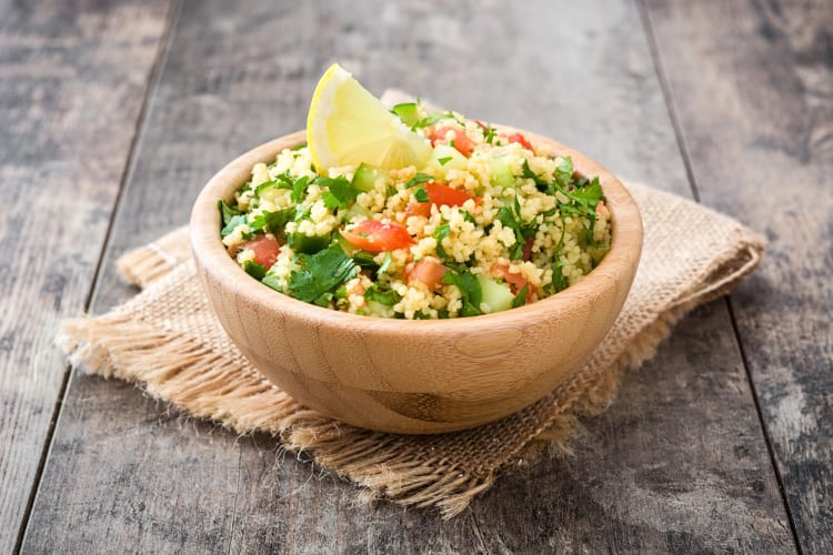 A bowl of tabbouleh, which is a popular Middle Eastern food