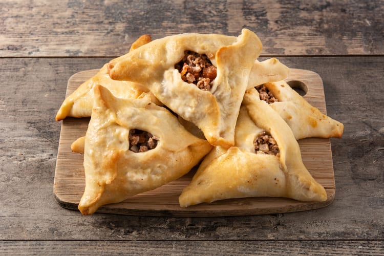 Fatayer served on a wooden board