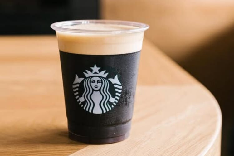 A Starbucks  Nitro Cold Brew on a wooden surface