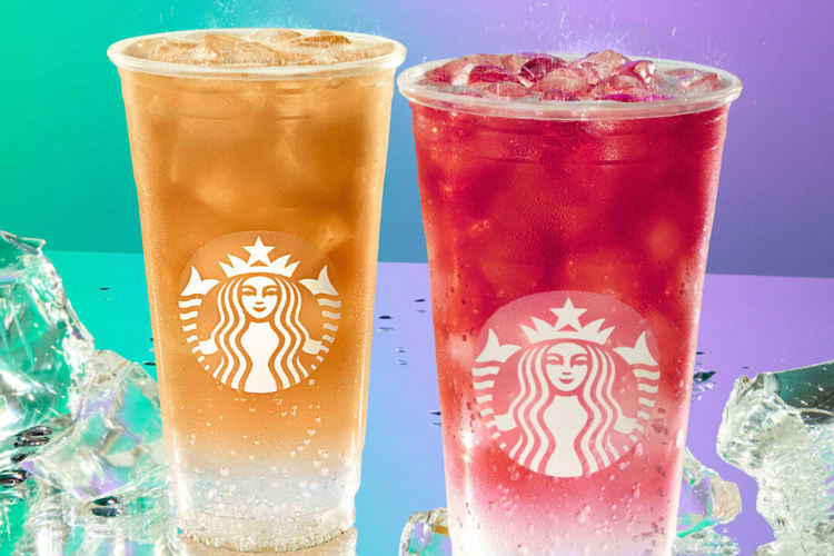 Two Iced Energy Drinks from Starbucks on a multi-colored background, surrounded by ice