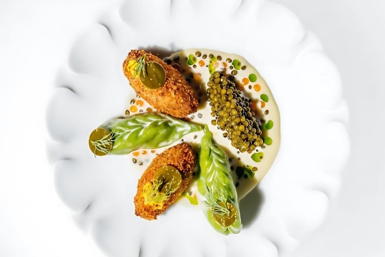 Bacalao ravioli with champagne and caviar
