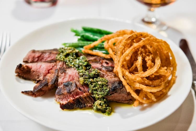 Le Bern's American wagyu bavette steak served with onion rings