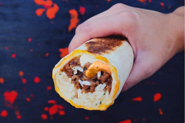 Burrito served with cheese and rice