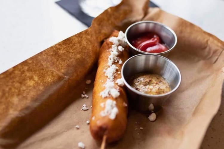 Pork ginger bratwurst corn dog is delightful at this Nashville restaurant