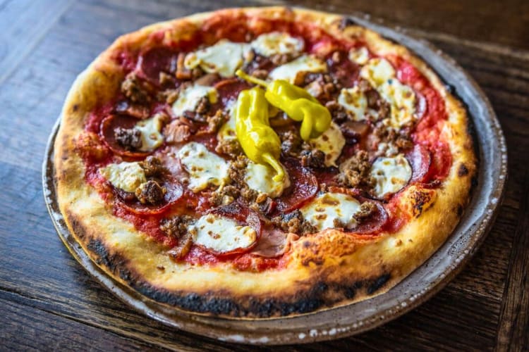 Woodfire pizza is a classic Italian dish at this Nashville restaurant