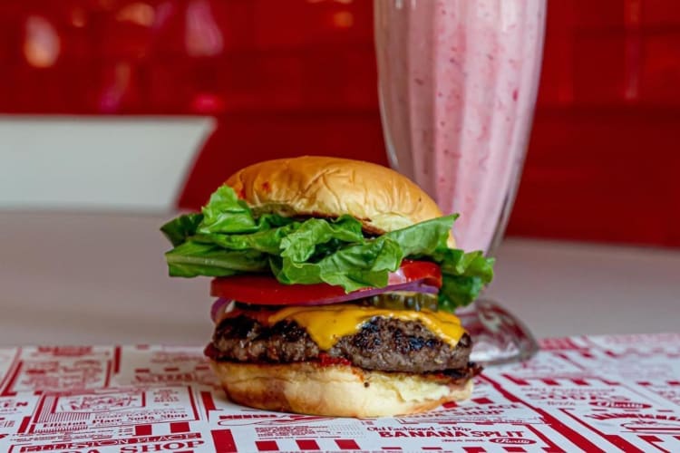 Classic cheeseburger and a strawberry milkshake