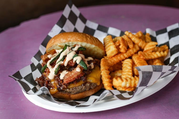 BBQ bacon burger served with crinkle-cut fries