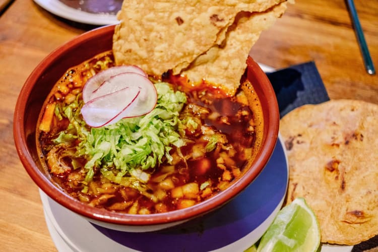 Chicken and Corn Soup with Mexican Lettuce, a Traditional Pozole.