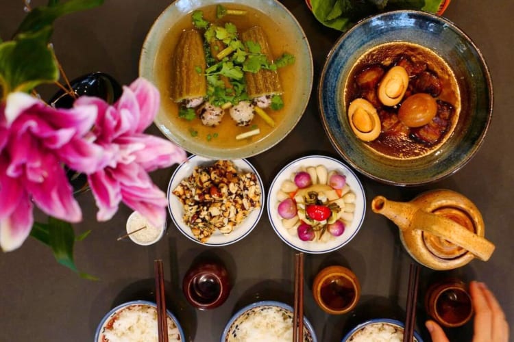 a selection of Vietnamese dishes on a wooden table