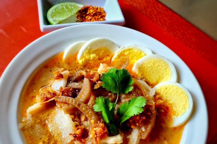 a Myanmar curry soup including eggs and vegetables 