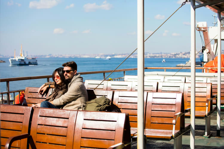 A couple taking a ferry ride together, which is a great one-year anniversary date idea