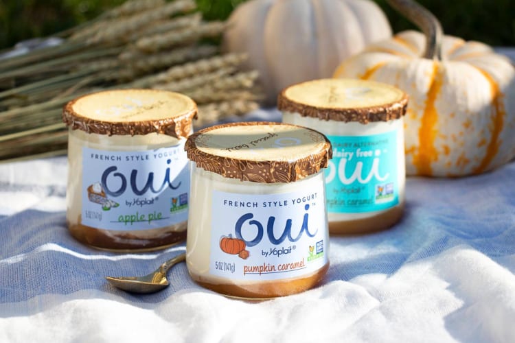Three jars of Oui yogurt on a tablecloth