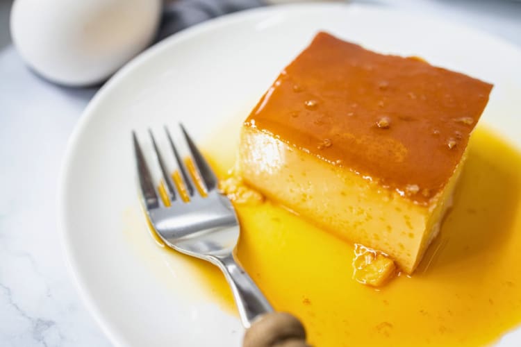 Slice of sweet leche flan on a plate.