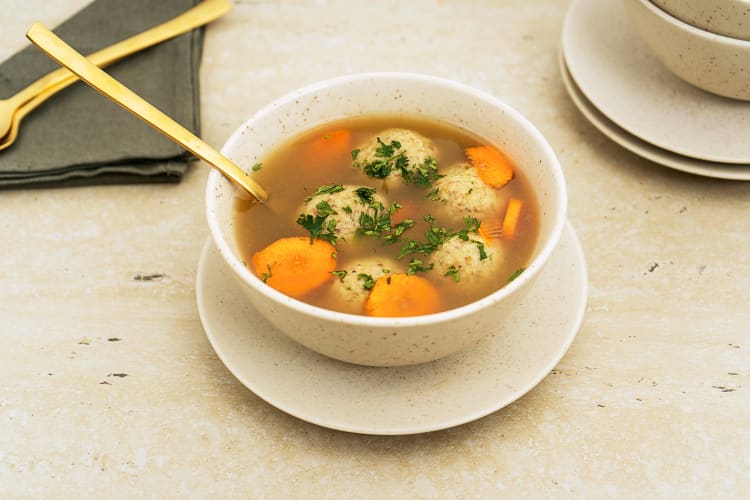 A bowl of chicken matzo ball soup, a popular Passover food