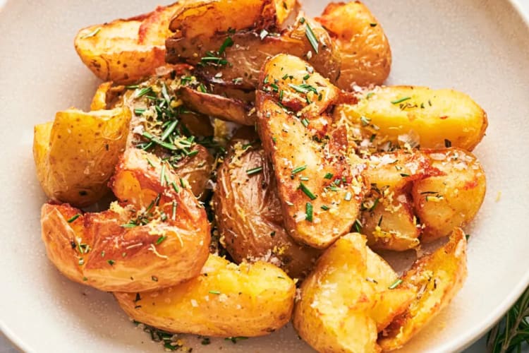 Close-up of a bowl of rosemary potatoes — a delicious option as a Passover food