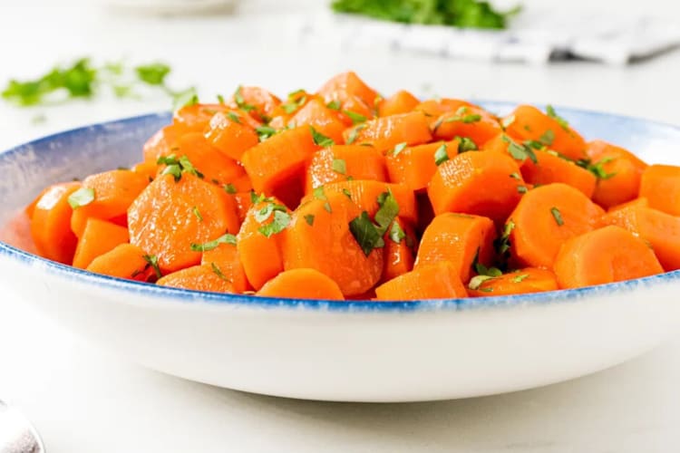 A bowl of candied carrots, a great dish to serve as a Passover food