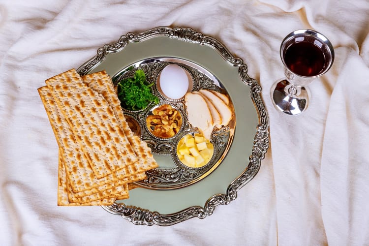 Aerial view of wine, matzo and the six foods part of a Passover meal