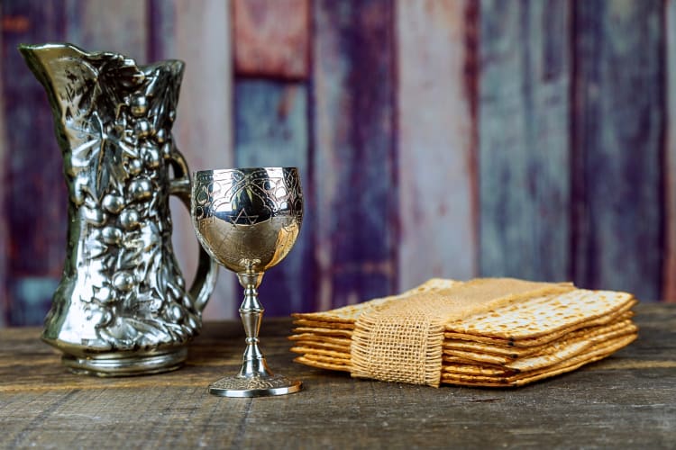 Matzo, a wine jug and a wine glass — all important parts of a Passover meal